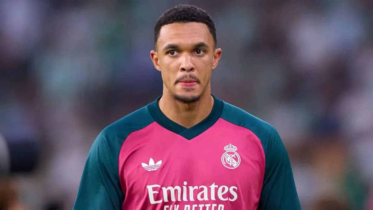 Goalkeeper in pink kit during match warm-up