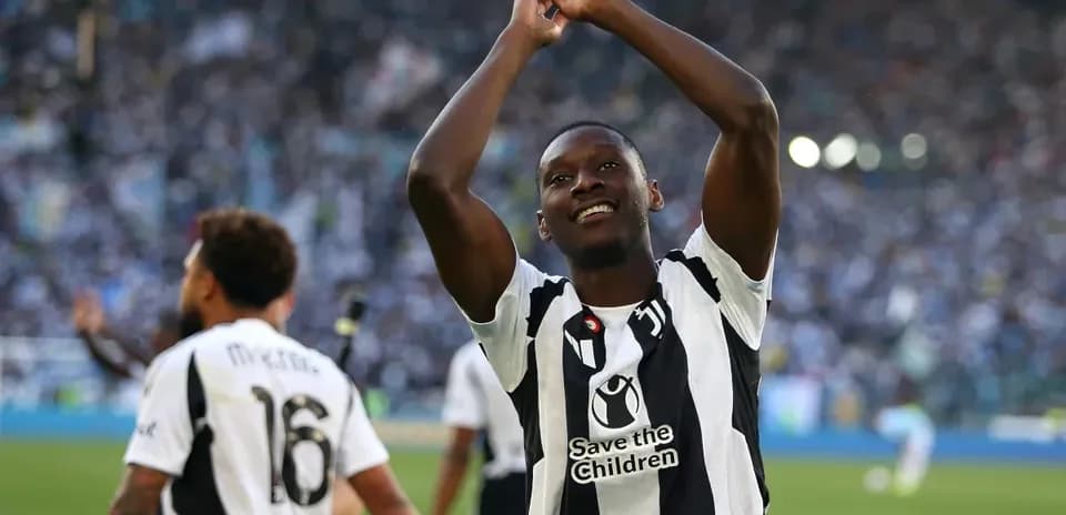Player celebrating in front of cheering crowd
