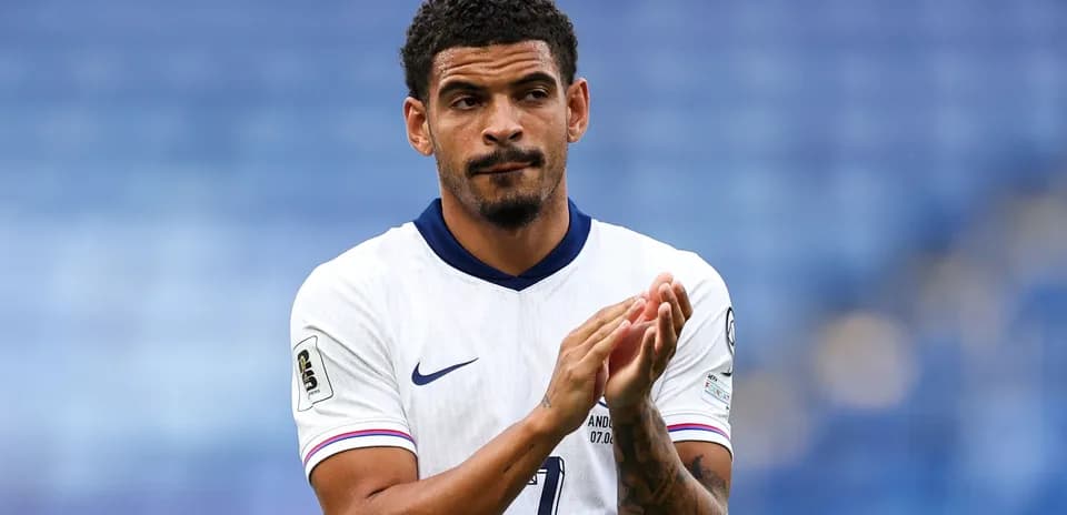 Player clapping in team jersey on field