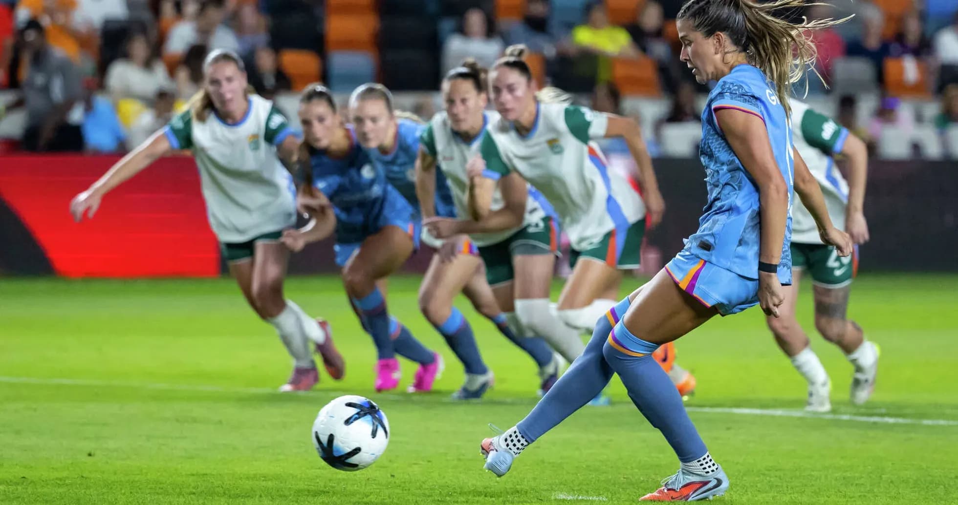 Player taking penalty kick during match