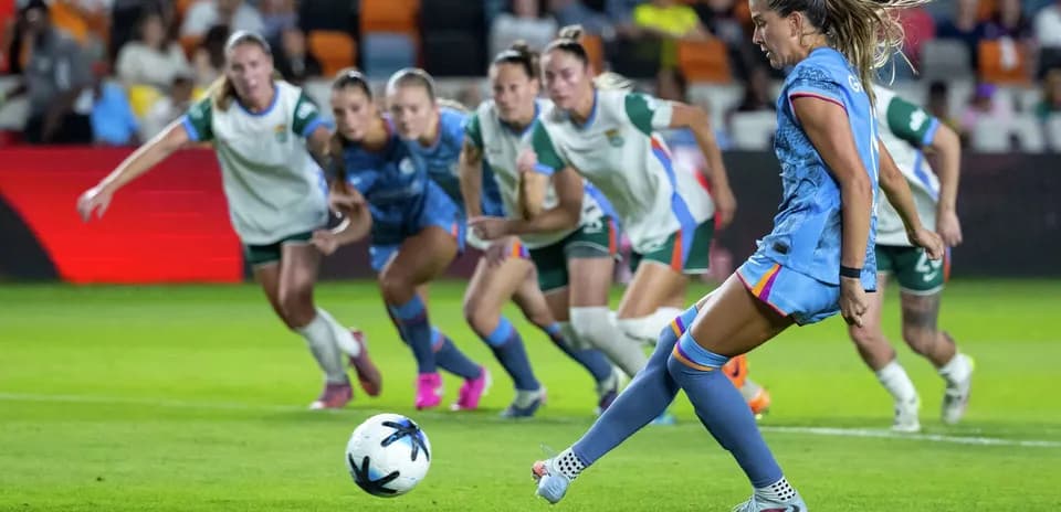 Player taking penalty kick during match
