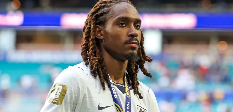 Player wearing England kit walking off the pitch