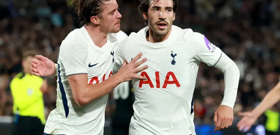 Tottenham players celebrating a goal on the pitch
