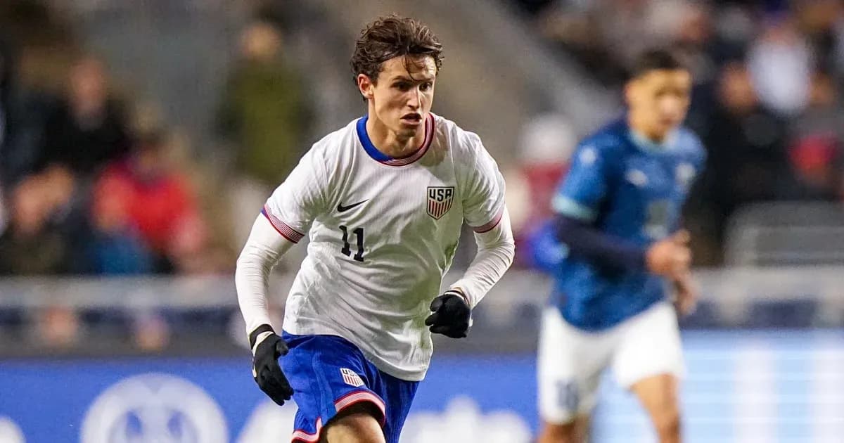 Player in USA jersey running during soccer match