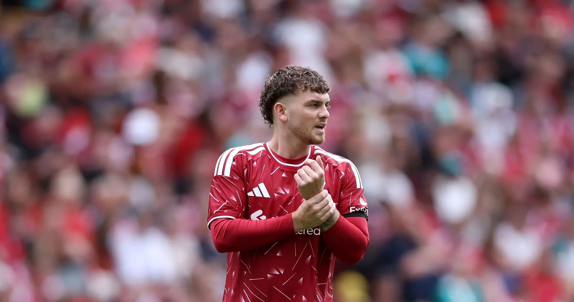 Player adjusting his captain's armband during match