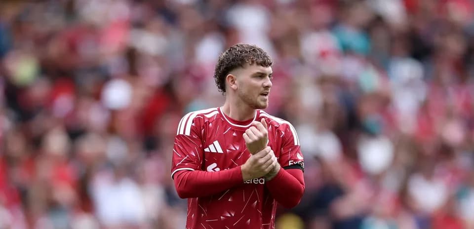 Player adjusting his captain's armband during match