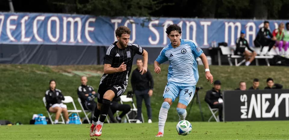 Players competing for the ball in MLS Next Pro match