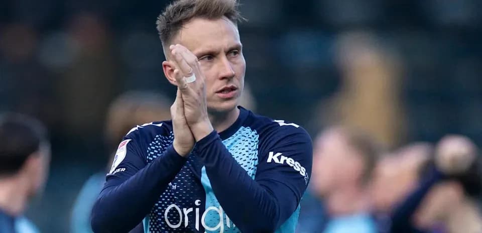Player applauding fans after the match