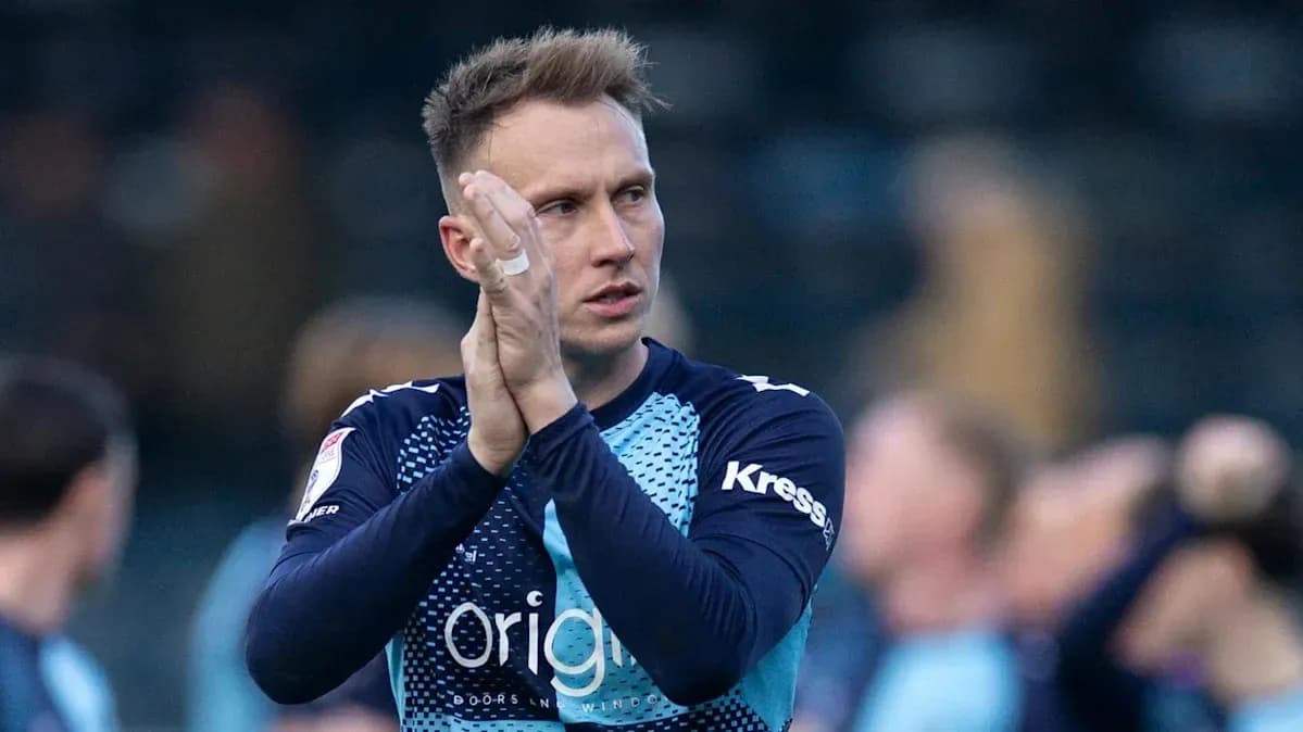 Player applauding fans after the match