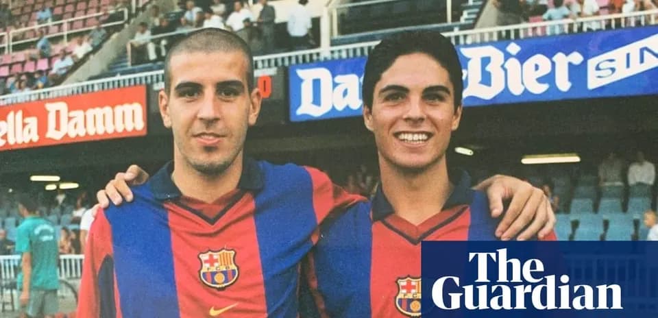 Two young football players posing in Barcelona jerseys