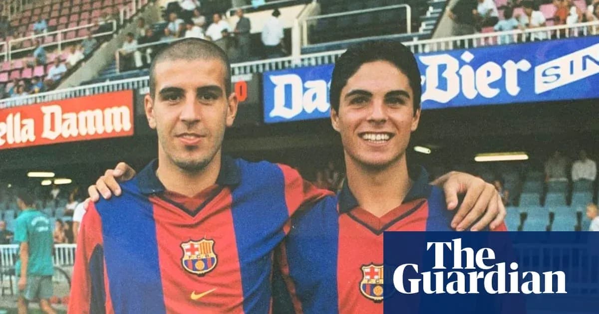Two young football players posing in Barcelona jerseys