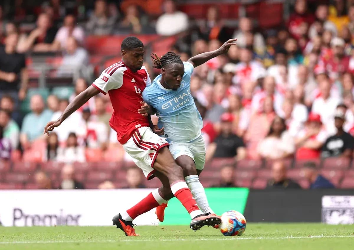 Two players contesting the ball during a match