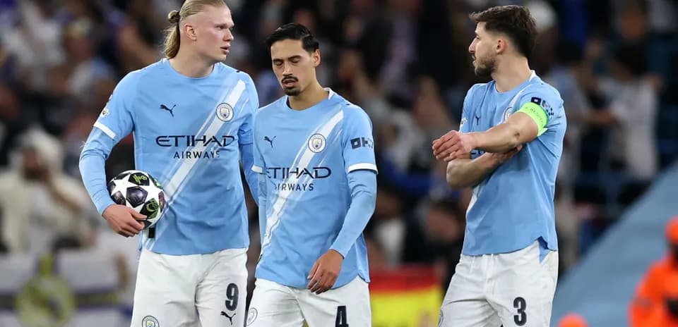 Manchester City players discussing during a match