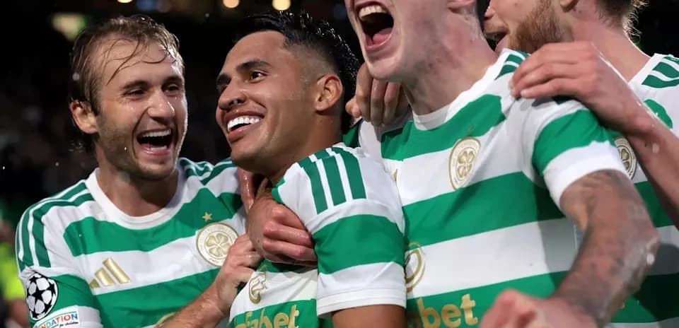 Celtic players celebrating a goal in match
