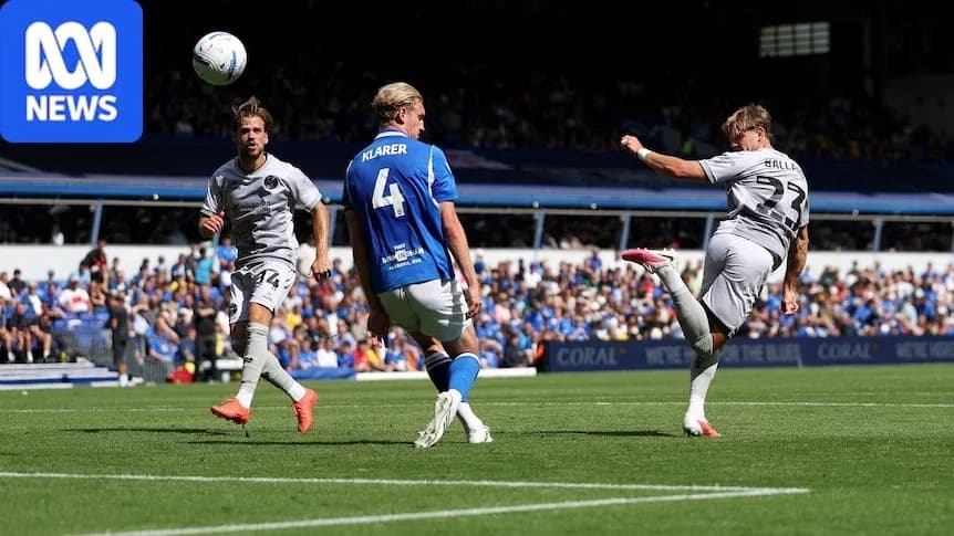 Player striking the ball during a soccer match