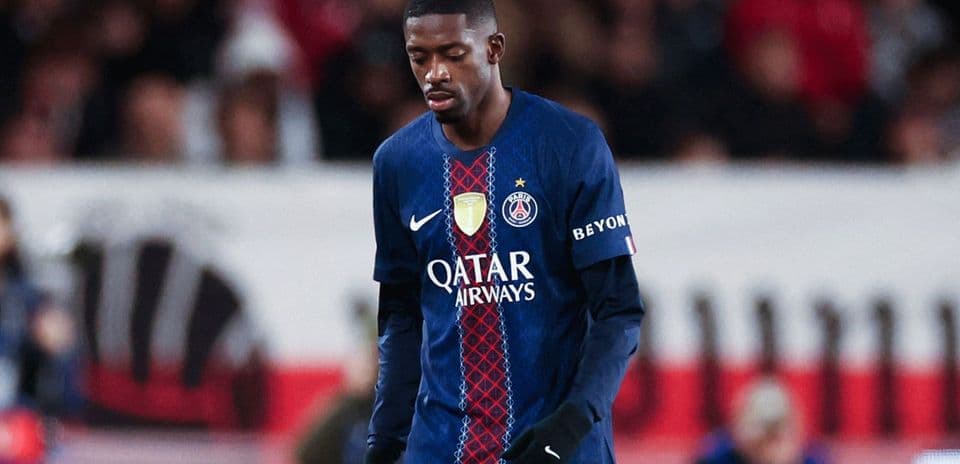 Player in PSG jersey walking with head down
