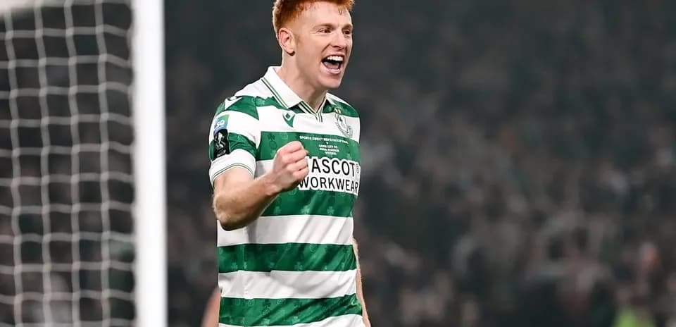 Player celebrating in green and white striped jersey