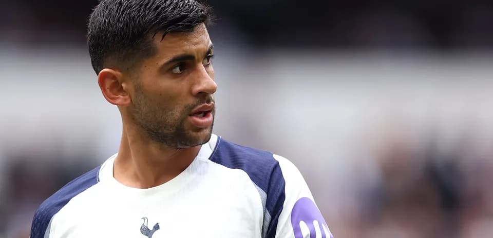 Player in Tottenham kit looking away during match