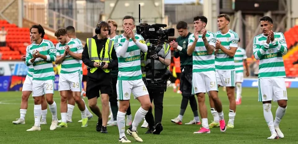 Celtic players applauding fans after a match