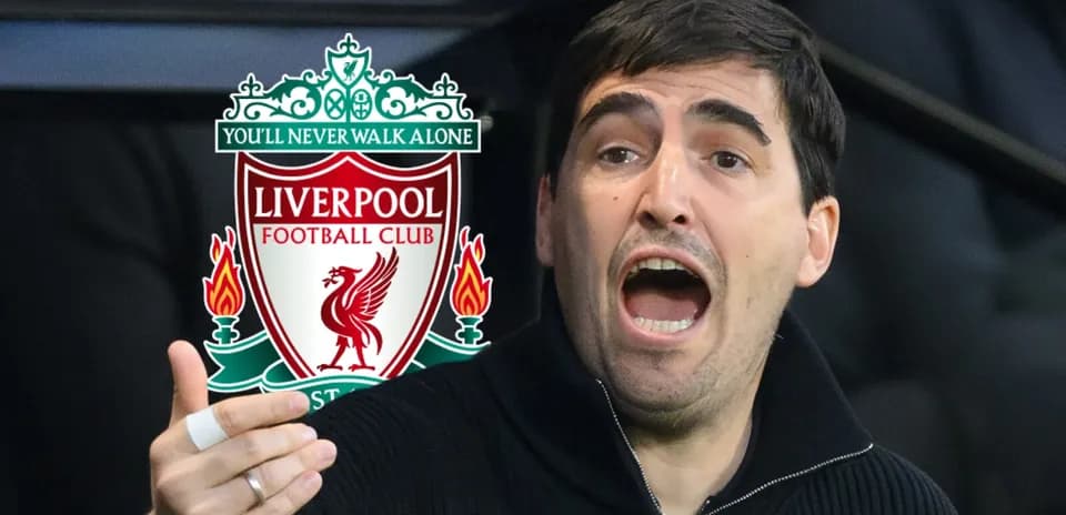 Coach gesturing passionately near Liverpool FC logo