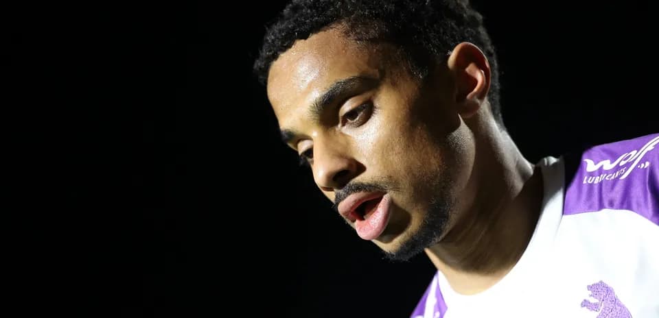 Player looking down during post-match interview