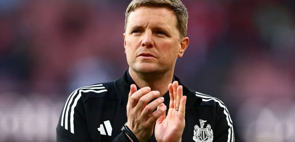 Manager applauding during a match at stadium