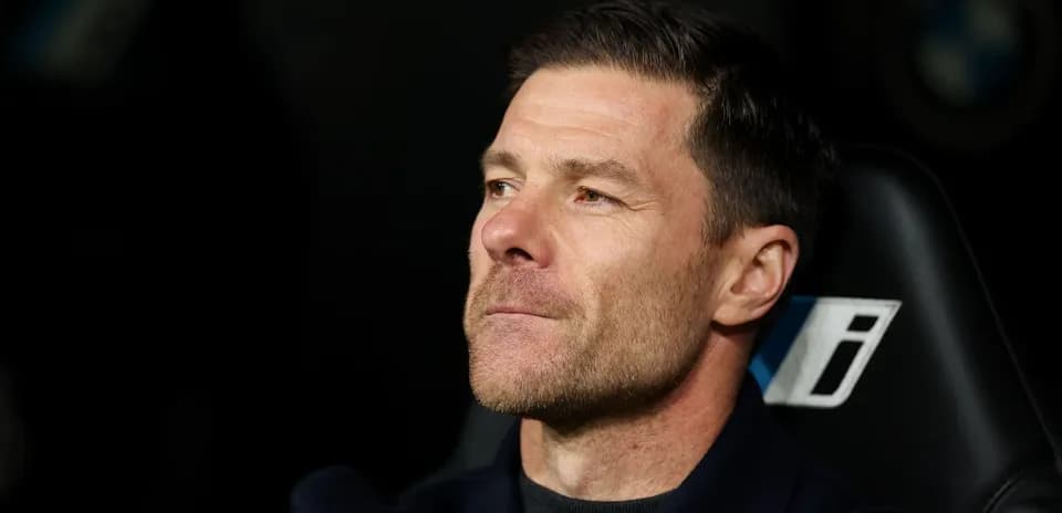 Coach observing from the sidelines during match