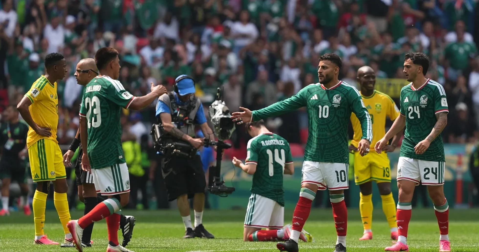Mexico players celebrating during match against South Africa