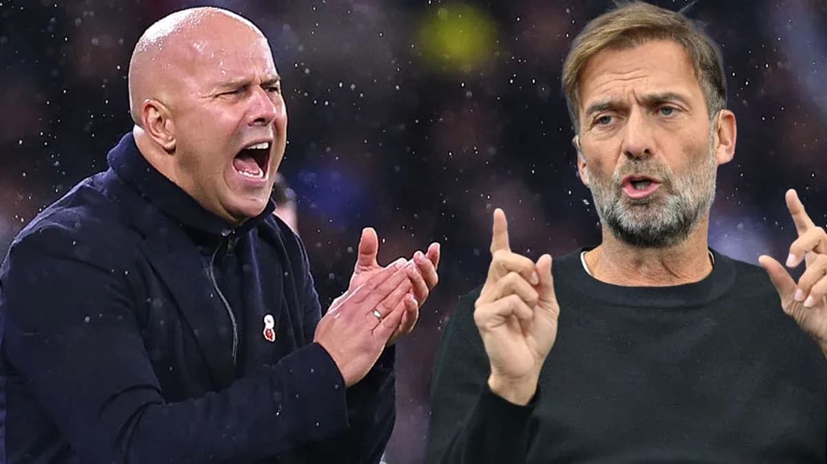 Two football managers gesturing during a match