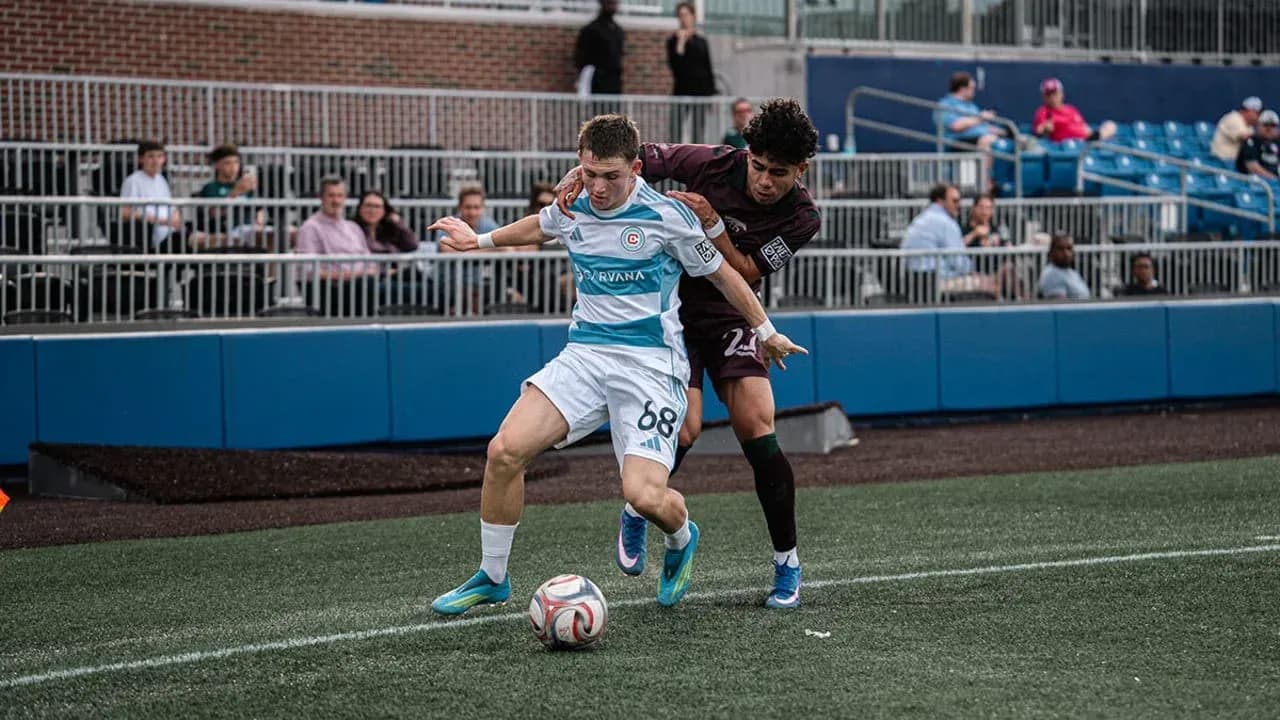 Player tackling opponent during Carolina Core match