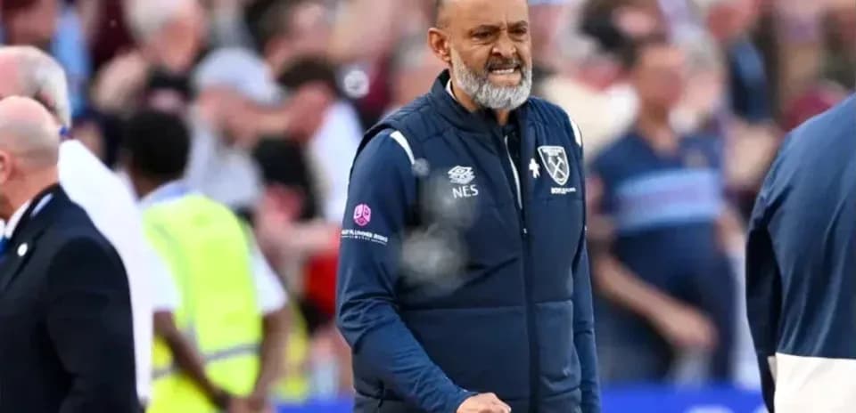 Manager celebrating on the sideline during match