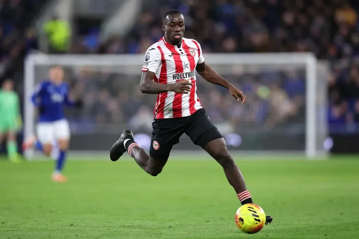 Player running with ball during football match