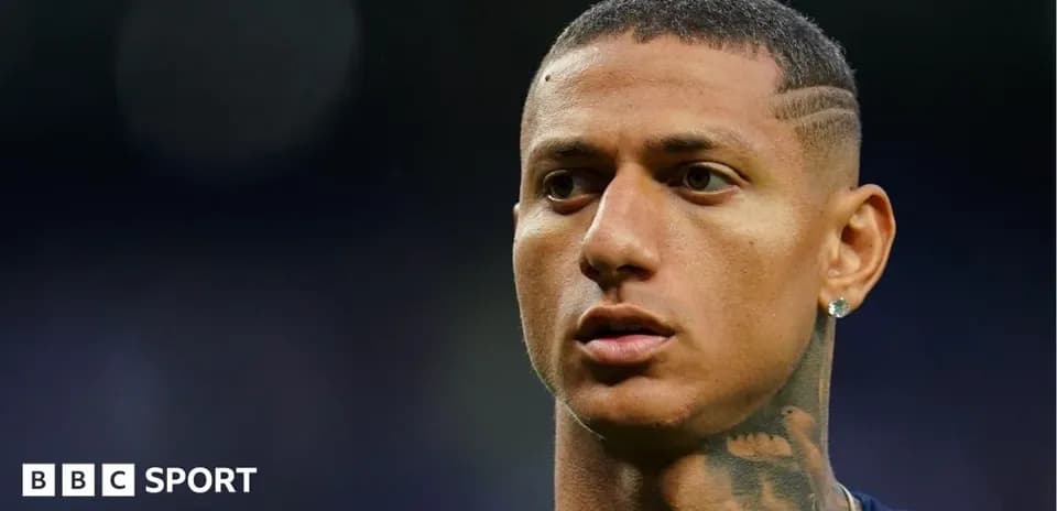 Football player with close-cropped hair and tattoos