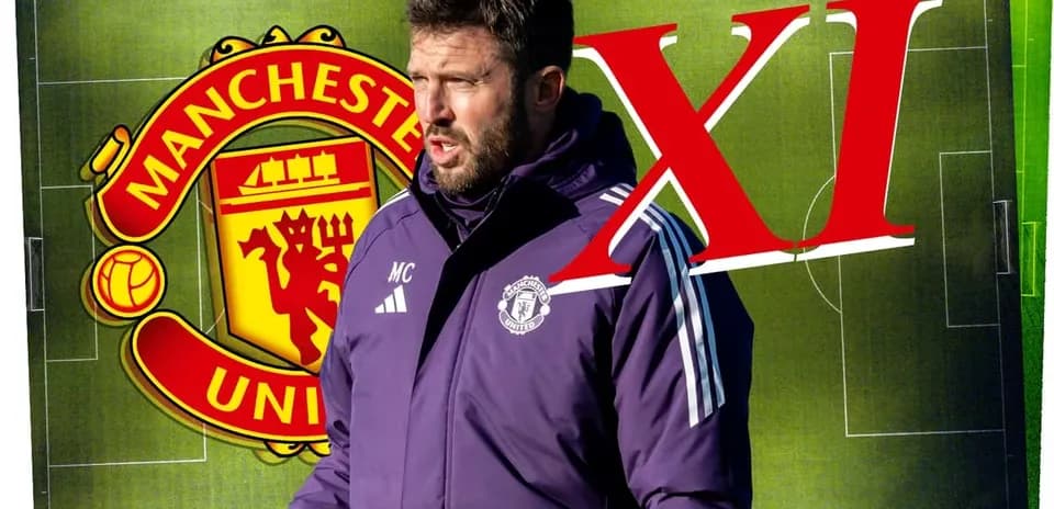 Coach speaking with Manchester United logo in background