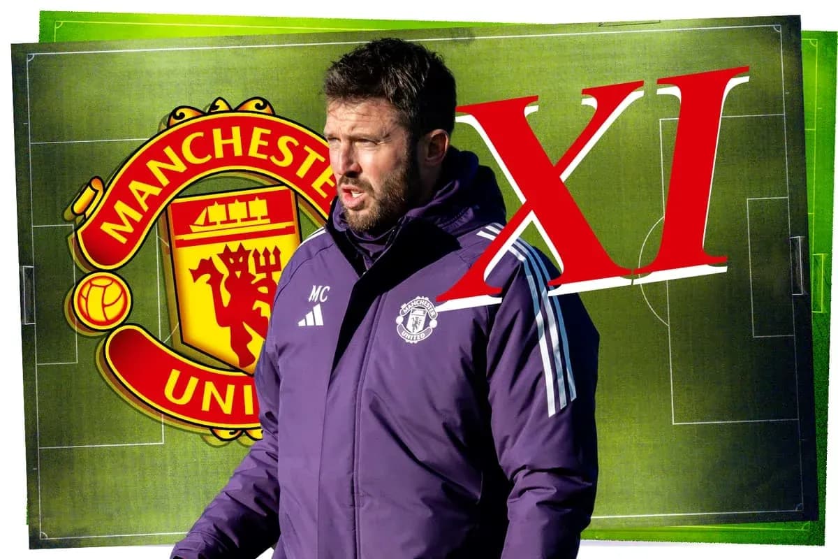 Coach speaking with Manchester United logo in background