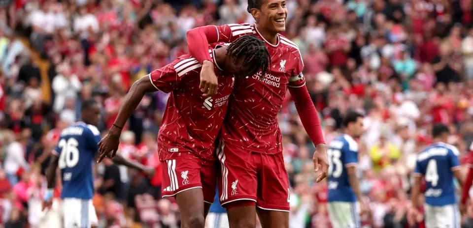 Liverpool players celebrating a goal on the pitch