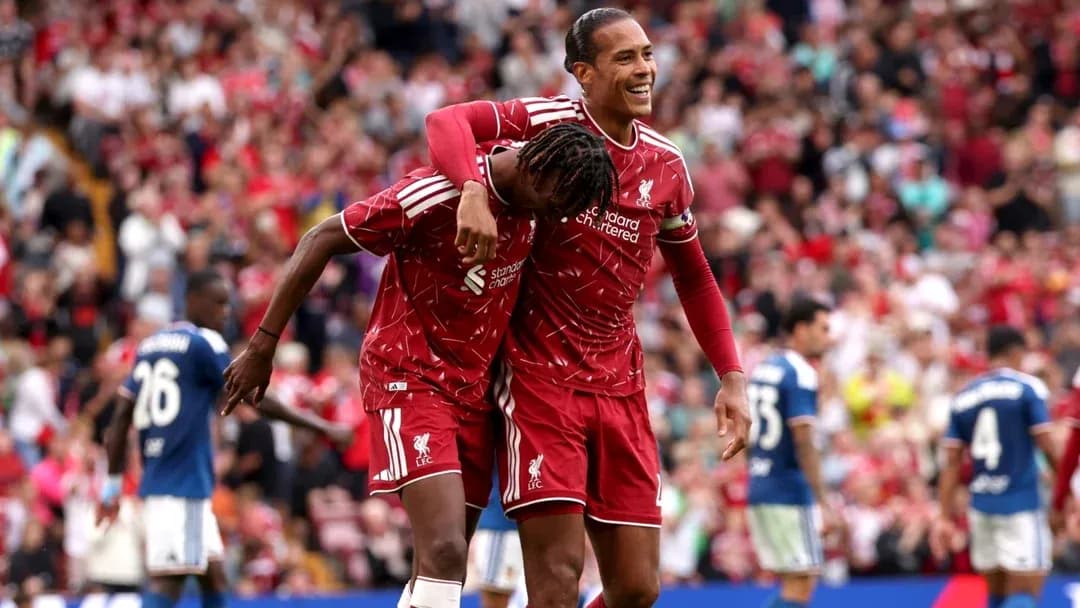 Liverpool players celebrating a goal on the pitch