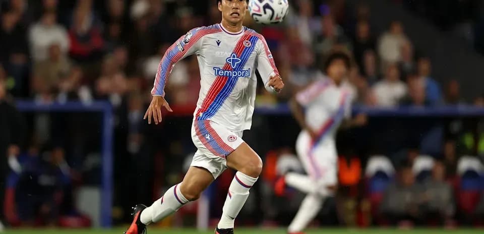 Player sprinting after the ball during a match
