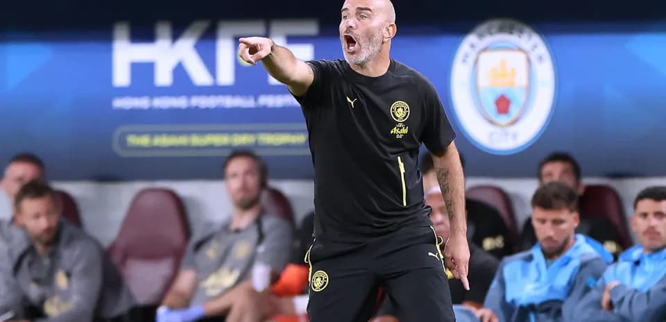 Coach directing players from the sidelines during match