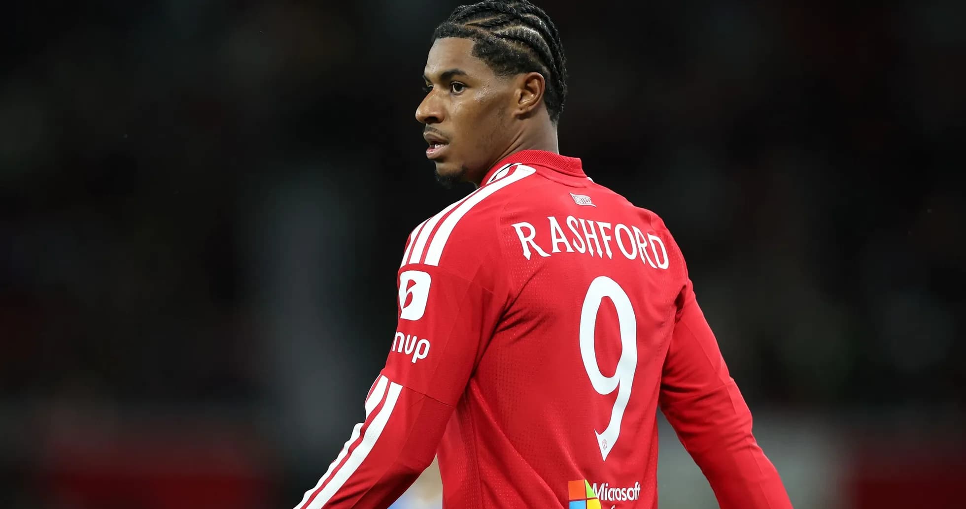Player wearing red jersey with 'RASHFORD' and number 9