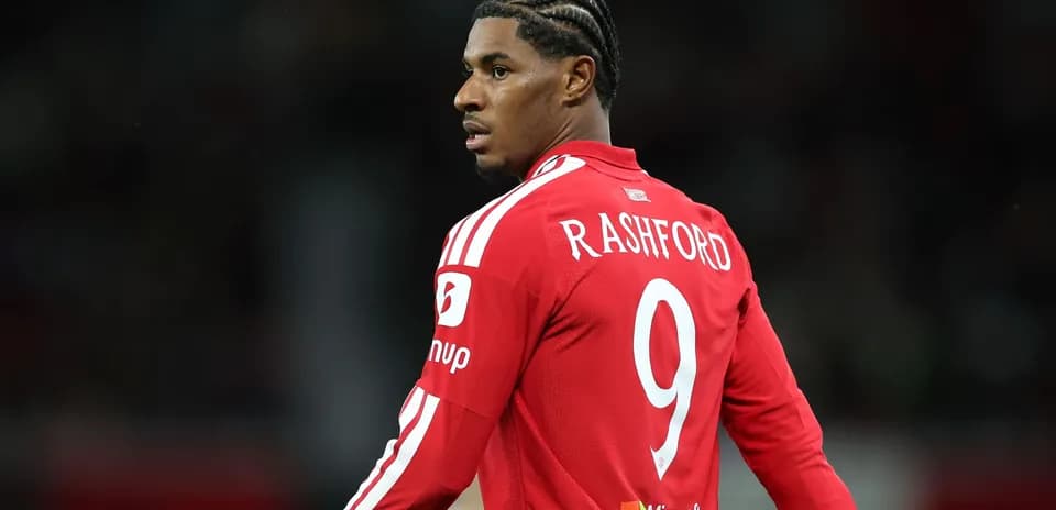 Player wearing red jersey with 'RASHFORD' and number 9