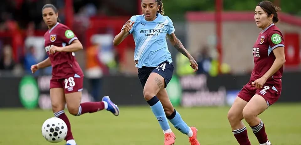 Player sprinting with ball during match action