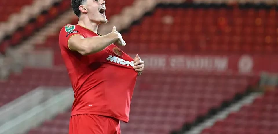 Player celebrating and pulling shirt after scoring