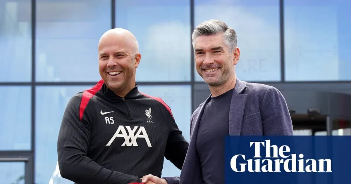 Two coaches shaking hands outside training facility
