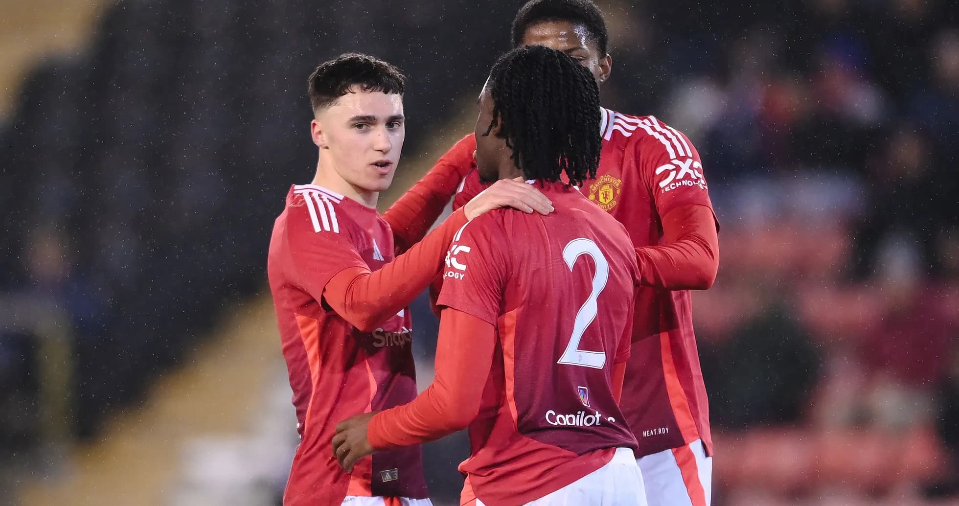 Manchester United players celebrating a goal together