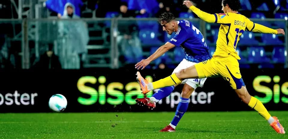 Player kicking the ball during Hellas Verona match