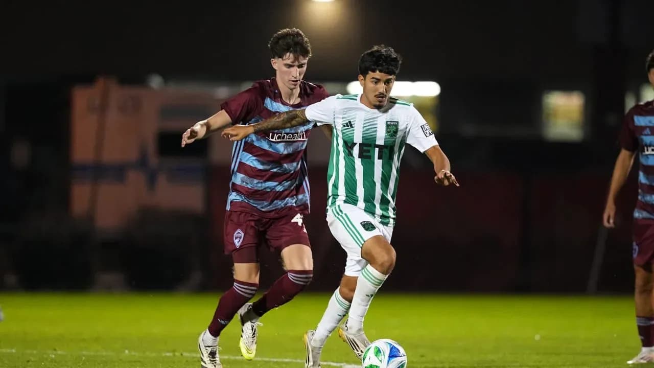 Player dribbling while being challenged during match