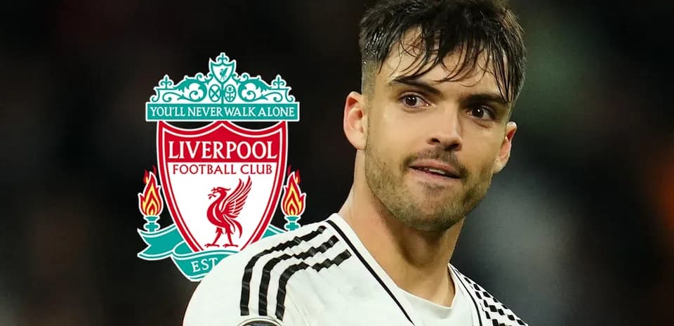 Player in Liverpool kit with club logo background