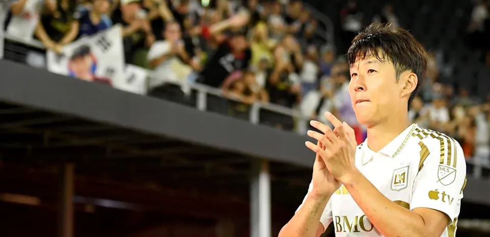 Player clapping in front of cheering fans