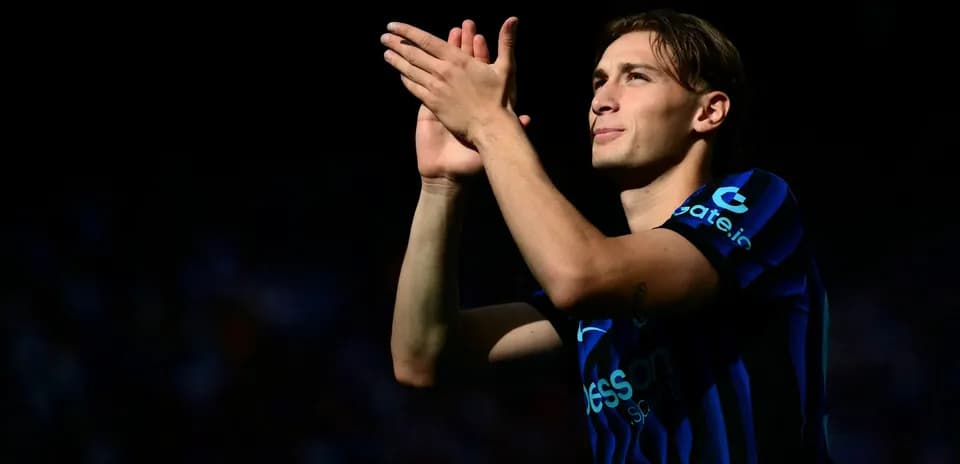 Player applauding fans in a stadium